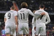 MADRID, SPAIN - MARCH 15: Gareth Bale of Real Madrid celebrates with Cristiano Ronaldo and Karim Benzema after scoring Real's opening goal during the La Liga match between Real Madrid CF and Levante UD at Estadio Santiago Bernabeu on March 15, 2015 in Madrid, Spain. (Photo by Denis Doyle/Getty Images)