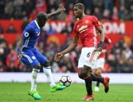 MANCHESTER, ENGLAND - APRIL 16: N'Golo Kante of Chelsea tackles Paul Pogba of Manchester United during the Premier League match between Manchester United and Chelsea at Old Trafford on April 16, 2017 in Manchester, England. (Photo by Michael Regan/Getty Images)