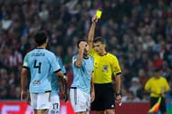BILBAO, SPAIN - SEPTEMBER 16: Hugo Mallo of RC Celta de Vigo is shown a yellow card by referee Gil Manzano during the La Liga match between Athletic Club and RC Celta de Vigo at San Mames Stadium on September 16, 2013 in Bilbao, Spain. (Photo by David Ramos/Getty Images)