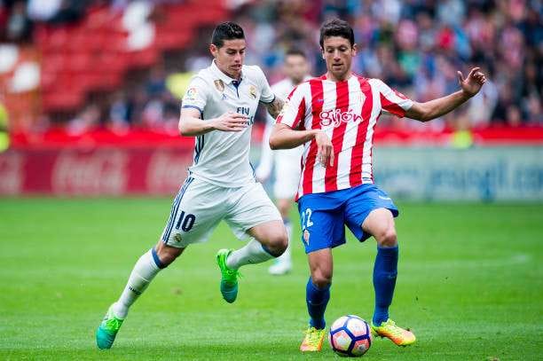 GIJON, SPAIN - APRIL 15: James Rodriguez of Real Madrid duels for the ball with Mikel Vesga of Real Sporting de Gijon during the La Liga match between Real Sporting de Gijon and Real Madrid at Estadio El Molinon on April 15, 2017 in Gijon, Spain. (Photo by Juan Manuel Serrano Arce/Getty Images)