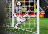 DONETSK, UKRAINE - JUNE 19: John Terry of England clears an effort from Marko Devic of Ukraine off the line during the UEFA EURO 2012 group D match between England and Ukraine at Donbass Arena on June 19, 2012 in Donetsk, Ukraine. (Photo by Laurence Griffiths/Getty Images)