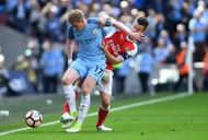 LONDON, ENGLAND - APRIL 23: Kevin De Bruyne of Manchester City controls the ball under pressure of Laurent Koscielny of Arsenal during the Emirates FA Cup Semi-Final match between Arsenal and Manchester City at Wembley Stadium on April 23, 2017 in London, England. (Photo by Mike Hewitt/Getty Images,)