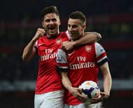 LONDON, ENGLAND - APRIL 28: Laurent Koscielny of Arsenal celebrates wth Olivier Giroud (L) as he scores their first goal during the Barclays Premier League match between Arsenal and Newcastle United at Emirates Stadium on April 28, 2014 in London, England. (Photo by Jamie McDonald/Getty Images)