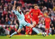 LIVERPOOL, ENGLAND - MARCH 12: Michael Keane of Burnley (L) attempts to tackle Lucas Leiva of Liverpool (C) during the Premier League match between Liverpool and Burnley at Anfield on March 12, 2017 in Liverpool, England. (Photo by Michael Regan/Getty Images)
