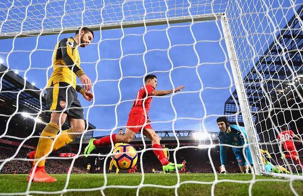 LIVERPOOL, ENGLAND - MARCH 04: Petr Cech of Arsenal (R) looks on as he lets Roberto Firmino of Liverpool (not pictured) score Liverpools first goal of the game during the Premier League match between Liverpool and Arsenal at Anfield on March 4, 2017 in Liverpool, England.  (Photo by Laurence Griffiths/Getty Images)
