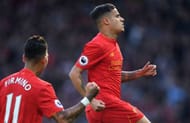 LIVERPOOL, ENGLAND - APRIL 23: Philippe Coutinho (R) of Liverpool celebrates scoring the opening goal from a free kick during the Premier League match between Liverpool and Crystal Palace at Anfield on April 23, 2017 in Liverpool, England. (Photo by Laurence Griffiths/Getty Images)