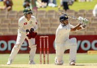 ADELAIDE, AUSTRALIA - JANUARY 27: Rahul Dravid of India sweeps with Brad Haddin of Australia looking on during day four of the Fourth Test Match between Australia and India at Adelaide Oval on January 27, 2012 in Adelaide, Australia. (Photo by Hamish Blair/Getty Images)