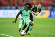 LYON, FRANCE - JULY 06: Renato Sanches of Portugal controls the ball under pressure of Chris Gunter of Wales during the UEFA EURO 2016 semi final match between Portugal and Wales at Stade des Lumieres on July 6, 2016 in Lyon, France. (Photo by Matthias Hangst/Getty Images)