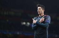 LONDON, ENGLAND - MARCH 07: Robert Lewandowski of Bayern Muenchen celebrates as he scores their first goal from a penalty during the UEFA Champions League Round of 16 second leg match between Arsenal FC and FC Bayern Muenchen at Emirates Stadium on March 7, 2017 in London, United Kingdom. (Photo by Clive Mason/Getty Images)