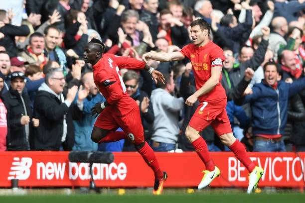 LIVERPOOL, ENGLAND - APRIL 01: Sadio Mane of Liverpool (L) celebrates scoring his sides first goal with James Milner of Liverpool (R) during the Premier League match between Liverpool and Everton at Anfield on April 1, 2017 in Liverpool, England.  (Photo by Gareth Copley/Getty Images)