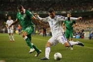 DUBLIN, IRELAND - NOVEMBER 16: Sead Kolasinac of Bosnia and Herzegovina crosses the ball under pressure from Jon Walters of the Republic of Ireland during the UEFA EURO 2016 Qualifier play off, second leg match between Republic of Ireland and Bosnia and Herzegovina at the Aviva Stadium on November 16, 2015 in Dublin, Ireland. (Photo by Ian Walton/Getty Images)