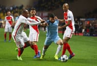 MONACO - MARCH 15: Sergio Aguero of Manchester City takes on Djibril Sidibe, Bernardo Silva and Fabinho of AS Monaco during the UEFA Champions League Round of 16 second leg match between AS Monaco and Manchester City FC at Stade Louis II on March 15, 2017 in Monaco, Monaco. (Photo by Michael Steele/Getty Images)