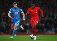 LIVERPOOL, ENGLAND - APRIL 05: Simon Francis of AFC Bournemouth chases Divock Origi of Liverpool during the Premier League match between Liverpool and AFC Bournemouth at Anfield on April 5, 2017 in Liverpool, England. (Photo by Clive Brunskill/Getty Images)