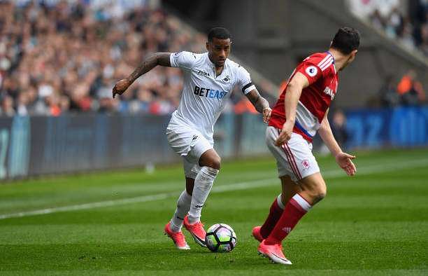 SWANSEA, WALES - APRIL 02:  Swansea winger Luciano Narsingh takes on Stewart Downing of the Boro during the Premier League match between Swansea City and Middlesbrough at Liberty Stadium on April 2, 2017 in Swansea, Wales.  (Photo by Stu Forster/Getty Images)