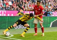 MUNICH, GERMANY - APRIL 08: Thiago of Bayern Muenchen challenges Marc Aregall Bartra of Dortmund during the Bundesliga match between Bayern Muenchen and Borussia Dortmund at Allianz Arena on April 8, 2017 in Munich, Germany. (Photo by Alexander Scheuber/Getty Images Fuer MAN)