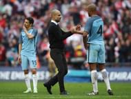LONDON, ENGLAND - APRIL 23:Vincent Kompany (R) of Manchester City is consoled by manager Josep Guardiola (C) during the Emirates FA Cup Semi-Final match between Arsenal and Manchester City at Wembley Stadium on April 23, 2017 in London, England. (Photo by Julian Finney/Getty Images,)
