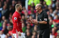 MANCHESTER, ENGLAND - APRIL 01: Wayne Rooney of Manchester United (L) and referee Mike Dean (R) speak during the Premier League match between Manchester United and West Bromwich Albion at Old Trafford on April 1, 2017 in Manchester, England. (Photo by Alex Livesey/Getty Images)