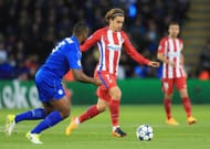 LEICESTER, ENGLAND - APRIL 18: Wes Morgan of Leicester City puts pressure on Antoine Griezmann of Atletico Madrid during the UEFA Champions League Quarter Final second leg match between Leicester City and Club Atletico de Madrid at The King Power Stadium on April 18, 2017 in Leicester, United Kingdom. (Photo by Richard Heathcote/Getty Images)