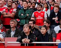 Wider Image: Jet-setting fans cannot resist allure of Premier League