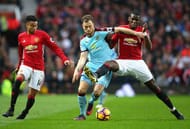 MANCHESTER, ENGLAND - OCTOBER 29: Ashley Barnes of Burnley (C) is tackled by Paul Pogba of Manchester United (R) and is put under pressure from Jesse Lingard of Manchester United (L) during the Premier League match between Manchester United and Burnley at Old Trafford on October 29, 2016 in Manchester, England. (Photo by Alex Livesey/Getty Images)
