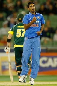 MELBOURNE, AUSTRALIA - JANUARY 18: Bhuvneshwar Kumar of India celebrates taking the wicket of Glenn Maxwell of Australia during the One Day International match between Australia and India at Melbourne Cricket Ground on January 18, 2015 in Melbourne, Australia. (Photo by Darrian Traynor/Getty Images)