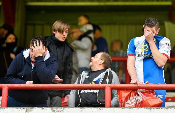 BRENTFORD, ENGLAND - MAY 07:   Blackburn Rovers fans look dejected after being relegated after the Sky Bet Championship match between Brentford and Blackburn Rovers at Griffin Park on May 7, 2017 in Brentford, England. (Photo by Justin Setterfield/Getty Images)