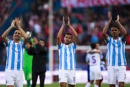 MADRID, SPAIN - APRIL 23: Charles Dias de Oliveira (L) of Malaga CF and his teammates Roberto Rosales (2ndL) and Weligton Robson (R) wave their fans after loosing the La Liga match between Club Atletico de Madrid and Malaga CF at Vicente Calderon Stadium on April 23, 2016 in Madrid, Spain. (Photo by Gonzalo Arroyo Moreno/Getty Images)