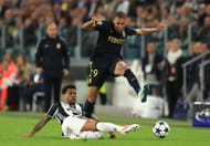 TURIN, ITALY - MAY 09: Dani Alves of Juventus tackles Kylian Mbappe of AS Monaco during the UEFA Champions League Semi Final second leg match between Juventus and AS Monaco at Juventus Stadium on May 9, 2017 in Turin, Italy. (Photo by Richard Heathcote/Getty Images)