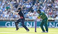 LEEDS, ENGLAND - MAY 24: England batsman Eoin Morgan hits out watched by South Africa wicketkeeper Quinton de Kock during the 1st Royal London One Day International match between England and South Aafrica at Headingley on May 24, 2017 in Leeds, England. (Photo by Stu Forster/Getty Images)