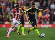 STOKE ON TRENT, ENGLAND - MAY 13: Geoff Cameron of Stoke City and Francis Coquelin of Arsneal battle for possession during the Premier League match between Stoke City and Arsenal at Bet365 Stadium on May 13, 2017 in Stoke on Trent, England. (Photo by Gareth Copley/Getty Images)