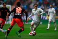 MADRID, SPAIN - APRIL 29: Luka Modric (R) of Real Madrid CF competes for the ball with Carlos Soler (L) of Valencia CF during the La Liga match between Real Madrid CF and Valencia CF at Estadio Santiago Bernabeu on April 29, 2017 in Madrid, Spain. (Photo by Gonzalo Arroyo Moreno/Getty Images)