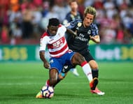 GRANADA, SPAIN - MAY 06: Martin Hongla of Granada CF (L) competes for the ball with Fabio Coentrao of Real Madrid CF (R) during the La Liga match between Granada CF v Real Madrid CF at Estadio Nuevo Los Carmenes on May 6, 2017 in Granada, Spain. (Photo by Aitor Alcalde/Getty Images)