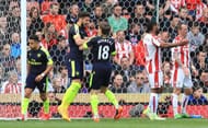 STOKE ON TRENT, ENGLAND - MAY 13: Olivier Giroud of Arsenal celebrates scoring his sides first goal with Nacho Monreal of Arsenal during the Premier League match between Stoke City and Arsenal at Bet365 Stadium on May 13, 2017 in Stoke on Trent, England. (Photo by Richard Heathcote/Getty Images)