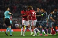 MANCHESTER, ENGLAND - MAY 11: Players from both sides clash in the build up to Eric Bailly of Manchester United and Facundo Roncaglia of Celta Vigo being shown a red card during the UEFA Europa League, semi final second leg match, between Manchester United and Celta Vigo at Old Trafford on May 11, 2017 in Manchester, United Kingdom. (Photo by Gareth Copley/Getty Images)