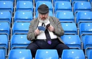 MANCHESTER, ENGLAND - APRIL 27: A supporter reads the match programme prior to the Premier League match between Manchester City and Manchester United at Etihad Stadium on April 27, 2017 in Manchester, England. (Photo by Laurence Griffiths/Getty Images)
