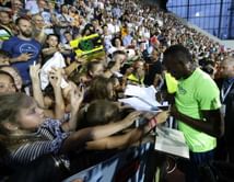Bolt holds on to win 100 meters at Golden Spike