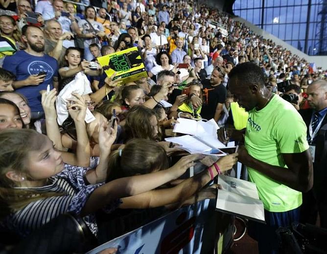 Bolt holds on to win 100 meters at Golden Spike