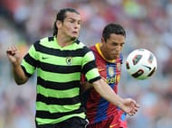 BARCELONA, SPAIN - SEPTEMBER 11: Adriano (R) of Barcelona fights for the ball with Nelson Valdez of Hercules during the La Liga match between Barcelona and Hercules at the Camp Nou stadium on September 11, 2010 in Barcelona, Spain. (Photo by Jasper Juinen/Getty Images)