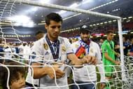 CARDIFF, WALES - JUNE 03: Alvaro Morata of Real Madrid cuts the net after the UEFA Champions League Final between Juventus and Real Madrid at National Stadium of Wales on June 3, 2017 in Cardiff, Wales. (Photo by Shaun Botterill/Getty Images)