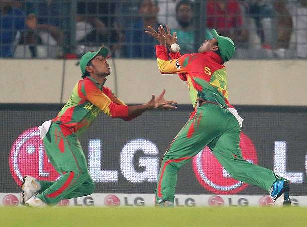 DHAKA, BANGLADESH - MARCH 28:  Anamul Haque and Sohag Gazi of Bangladesh drop a catch in the outfield during the ICC World Twenty20 Bangladesh 2014 match between Bangladesh and India at Sher-e-Bangla Mirpur Stadium on March 28, 2014 in Dhaka, Bangladesh.  (Photo by Scott Barbour/Getty Images)