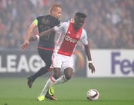 AMSTERDAM, NETHERLANDS - SEPTEMBER 29: Bertrand Traore of Ajax is challenged by Adrien Trebel of Standard Liege during the UEFA Europa League group G match between AFC Ajax and R. Standard de Liege at the Amsterdam Arena on September 29, 2016 in Amsterdam, Netherlands. (Photo by Dean Mouhtaropoulos/Getty Images)