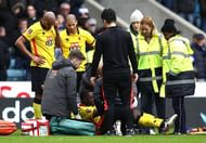 LONDON, ENGLAND - JANUARY 29: Brice Dja Djedje of Watford receives treatment from the medical team during The Emirates FA Cup Fourth Round match between Millwall and Watford at The Den on January 29, 2017 in London, England. (Photo by Julian Finney/Getty Images)
