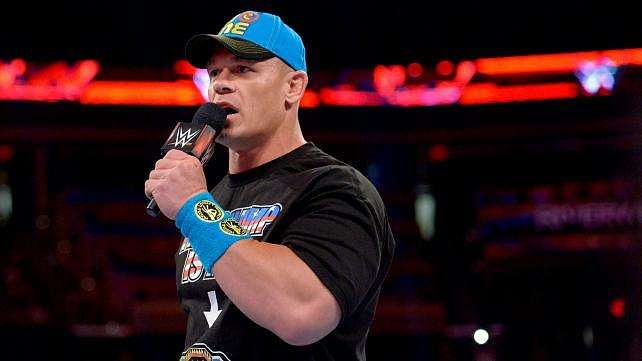 John Cena in the ring with a mic on RAW