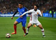 PARIS, FRANCE - MARCH 28: Corentin Tolisso of France is closed down by Isco of Spain during the International Friendly match between France and Spain at Stade de France on March 28, 2017 in Paris, France. (Photo by Dan Mullan/Getty Images)