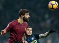 MILAN, ITALY - FEBRUARY 26: Federico Fazio of AS Roma (L) jumps for the ball against Mauro Emanuel Icardi of FC Internazionale Milano during the Serie A match between FC Internazionale and AS Roma at Stadio Giuseppe Meazza on February 26, 2017 in Milan, Italy. (Photo by Emilio Andreoli/Getty Images )