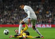 MADRID, SPAIN - DECEMBER 07: Gonzalo Castro of Borussia Dortmund (L) tackles Raphael Varane of Real Madrid (R) during the UEFA Champions League Group F match between Real Madrid CF and Borussia Dortmund at the Bernabeu on December 7, 2016 in Madrid, Spain. (Photo by Denis Doyle/Getty Images)