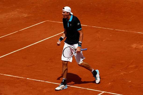 PARIS, FRANCE - JUNE 04:  John Isner of The United States celebrates during the mens singles third round match against Karen Khachanov of Russia on day eight of the 2017 French Open at Roland Garros on June 4, 2017 in Paris, France.  (Photo by Adam Pretty/Getty Images)