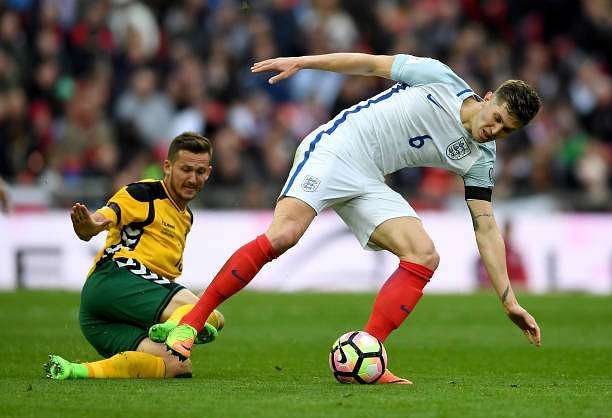 LONDON, ENGLAND - MARCH 26:  John Stones of England is tackled by Nerijus Valskis of Lithuania during the FIFA 2018 World Cup Qualifier between England and Lithuania at Wembley Stadium on March 26, 2017 in London, England.  (Photo by Laurence Griffiths/Getty Images)