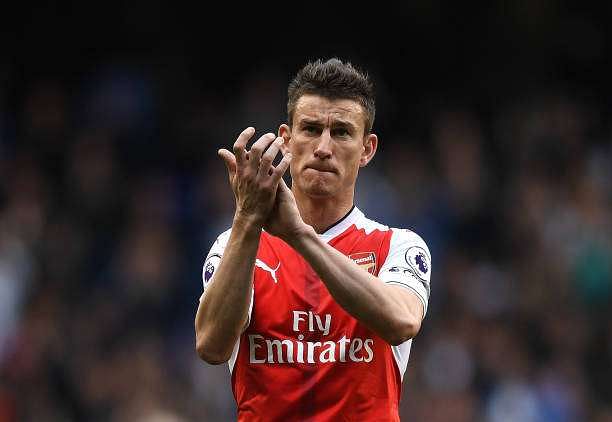 LONDON, ENGLAND - APRIL 30: Laurent Koscielny of Arsenal shows appreciation to the fans after the Premier League match between Tottenham Hotspur and Arsenal at White Hart Lane on April 30, 2017 in London, England.  (Photo by Shaun Botterill/Getty Images)