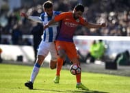 HUDDERSFIELD, ENGLAND - FEBRUARY 18: Martin Cranie of Huddersfield Town (L) and Nolito of Manchester City (R) battle for possession during The Emirates FA Cup Fifth Round match between Huddersfield Town and Manchester City at John Smith's Stadium on February 18, 2017 in Huddersfield, England. (Photo by Gareth Copley/Getty Images)
